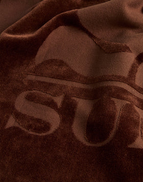 TOALLA DE RIZO JACQUARD CON LOGOTIPO Y BORDE